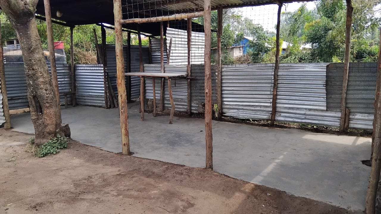 The renovated outdoor kitchen in Bondo, Kenya, with a new concrete floor